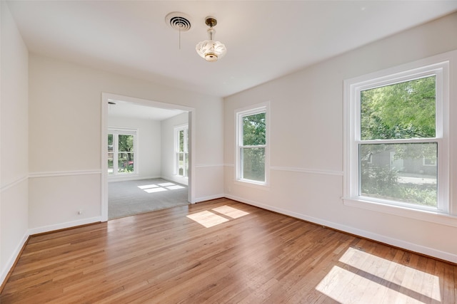 103 E 14th St, Joshua, TX 76058 - empty room featuring light wood finished floors and baseboards