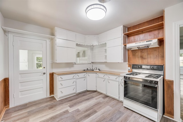 103 E 14th St, Joshua, TX 76058 - kitchen featuring gas range gas stove, open shelves, under cabinet range hood, and light countertops