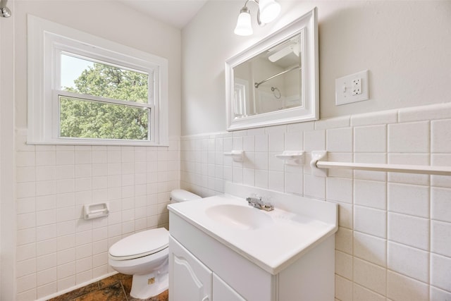 103 E 14th St, Joshua, TX 76058 - full bathroom featuring tile walls, vanity, a shower, and wainscoting