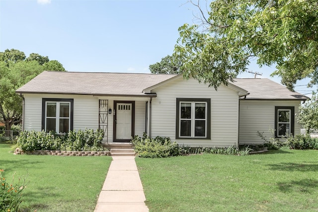 103 E 14th St, Joshua, TX 76058 - view of front facade featuring a front lawn and a shingled roof