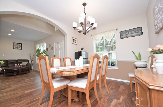 3209 Silver Point Ct, Mansfield, TX 76063 - dining area with dark wood-style flooring, arched walkways, a chandelier, and recessed lighting