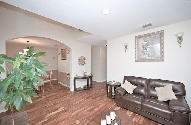 3209 Silver Point Ct, Mansfield, TX 76063 - living room featuring arched walkways and wood finished floors