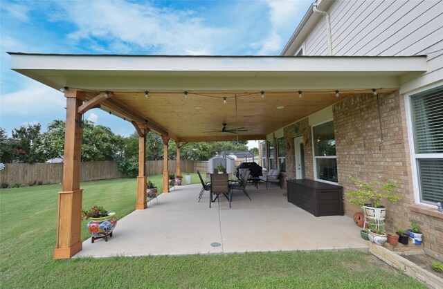 3209 Silver Point Ct, Mansfield, TX 76063 - fenced backyard with a shed, a ceiling fan, and a patio area