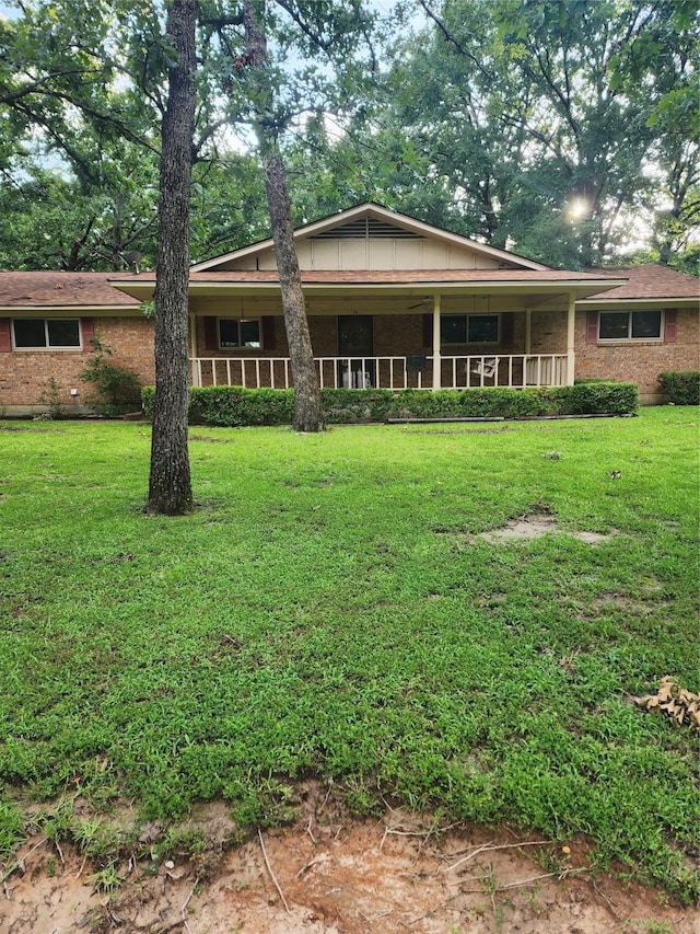 34 Sunset Blvd, Star Harbor, TX 75148 - view of front of house with brick siding and a front lawn