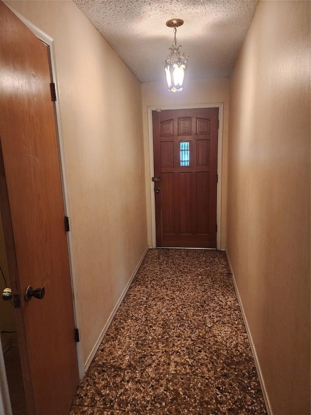 34 Sunset Blvd, Star Harbor, TX 75148 - entryway featuring a chandelier and a textured ceiling