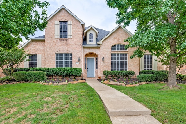 11722 Estacado Dr, Frisco, TX 75033 - view of front of property featuring a front yard, brick siding, and roof with shingles