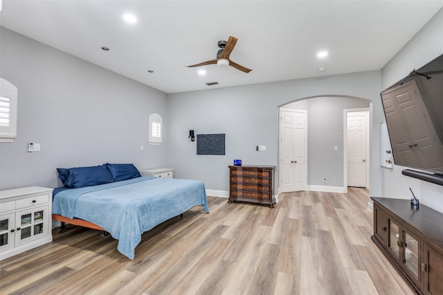 11722 Estacado Dr, Frisco, TX 75033 - bedroom with arched walkways, light wood-style floors, recessed lighting, and a ceiling fan