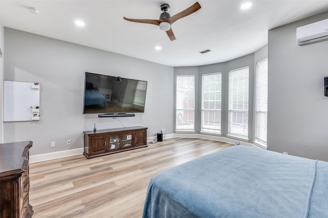 11722 Estacado Dr, Frisco, TX 75033 - bedroom featuring light wood-style floors, a wall unit AC, recessed lighting, and a ceiling fan