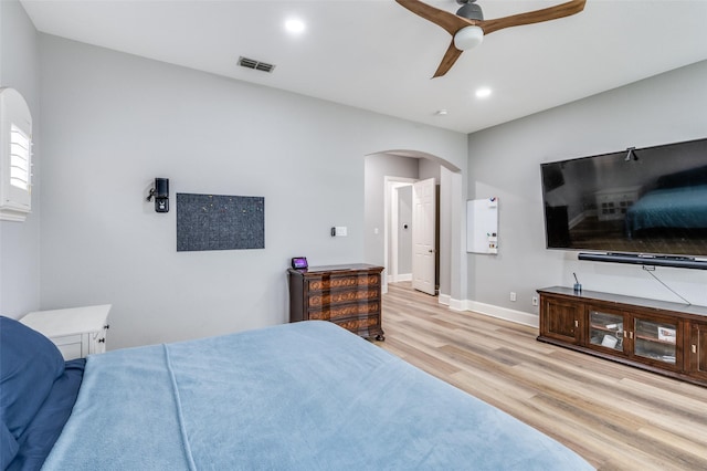11722 Estacado Dr, Frisco, TX 75033 - bedroom with arched walkways, wood finished floors, recessed lighting, and a ceiling fan
