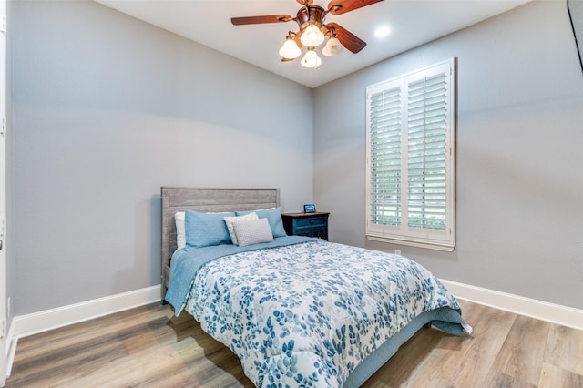 11722 Estacado Dr, Frisco, TX 75033 - bedroom with wood finished floors and a ceiling fan