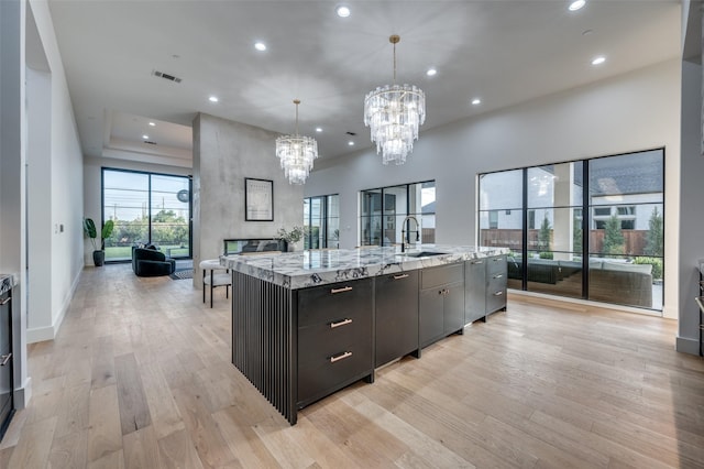 3527 Torrance Blvd, Frisco, TX 75034 - kitchen with recessed lighting, open floor plan, a chandelier, light wood-type flooring, and plenty of natural light