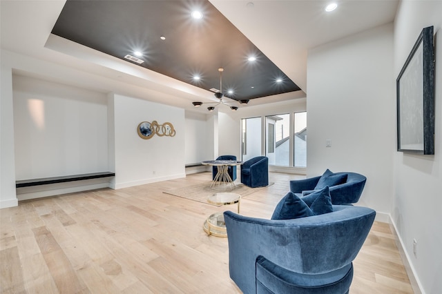 3527 Torrance Blvd, Frisco, TX 75034 - sitting room featuring a tray ceiling, light wood-style floors, recessed lighting, and a baseboard radiator