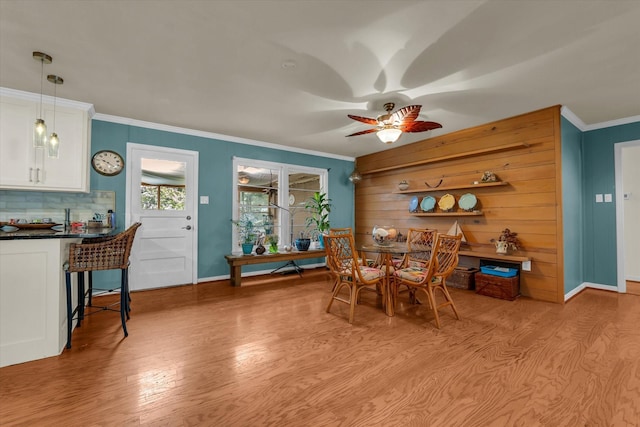 2113 Trinity Dr, Waco, TX 76710 - dining room featuring crown molding, a ceiling fan, and light wood finished floors