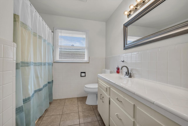 2113 Trinity Dr, Waco, TX 76710 - bathroom featuring vanity, tile patterned floors, tile walls, a wainscoted wall, and a shower with shower curtain