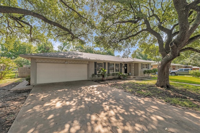 2113 Trinity Dr, Waco, TX 76710 - ranch-style home featuring an attached garage, concrete driveway, and stucco siding