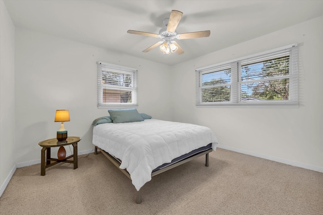 2113 Trinity Dr, Waco, TX 76710 - bedroom with multiple windows, light carpet, and a ceiling fan