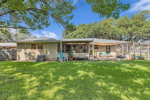2113 Trinity Dr, Waco, TX 76710 - rear view of property featuring a fenced backyard, a sunroom, brick siding, and a gate