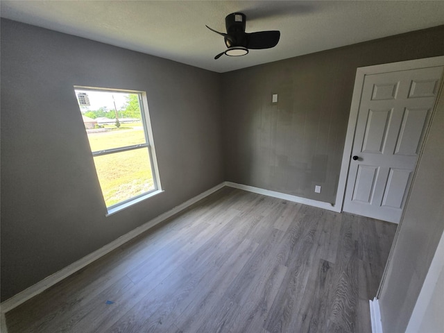 130 Jackson St N, Sulphur Springs, TX 75482 - unfurnished room with wood finished floors and ceiling fan