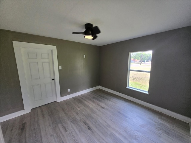 130 Jackson St N, Sulphur Springs, TX 75482 - empty room featuring wood finished floors and a ceiling fan