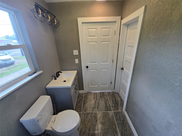 130 Jackson St N, Sulphur Springs, TX 75482 - bathroom featuring vanity and a textured wall