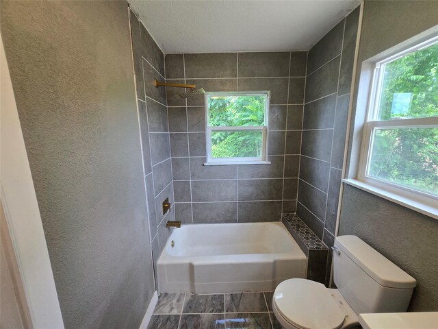 130 Jackson St N, Sulphur Springs, TX 75482 - full bathroom featuring tub / shower combination and a textured wall