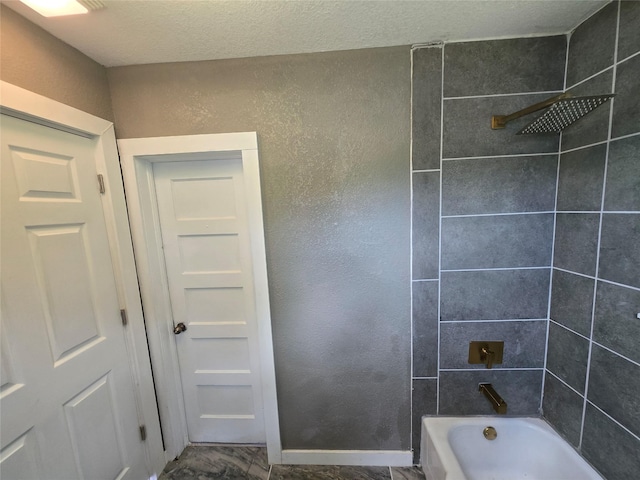 130 Jackson St N, Sulphur Springs, TX 75482 - bathroom with bathtub / shower combination and a textured wall