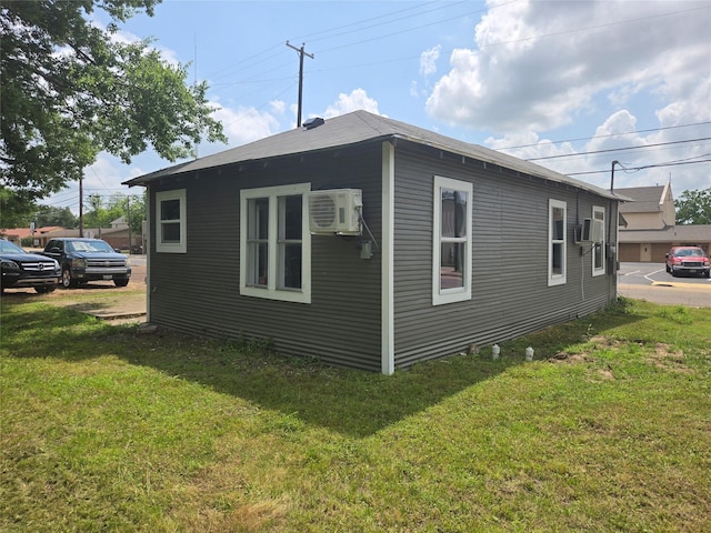 130 Jackson St N, Sulphur Springs, TX 75482 - view of side of property with a lawn and cooling unit
