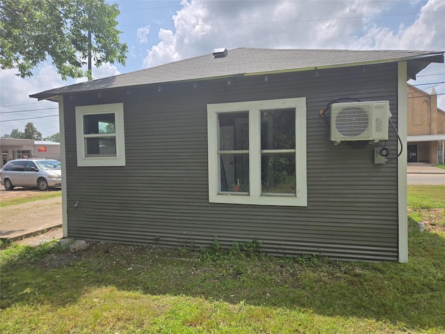 130 Jackson St N, Sulphur Springs, TX 75482 - view of home's exterior with a cooling unit and a shingled roof