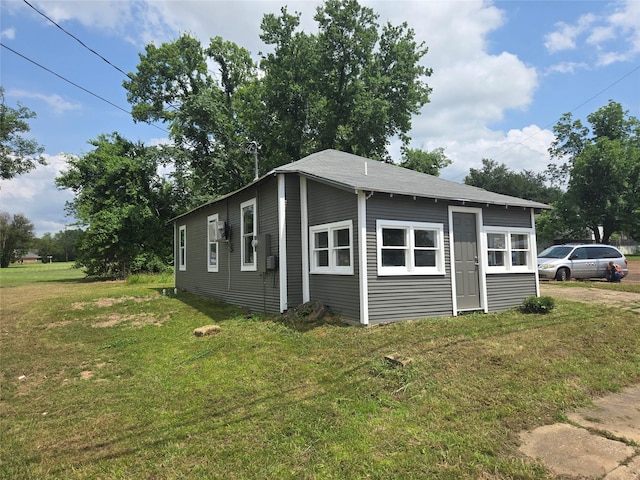 130 Jackson St N, Sulphur Springs, TX 75482 - view of side of home featuring a lawn