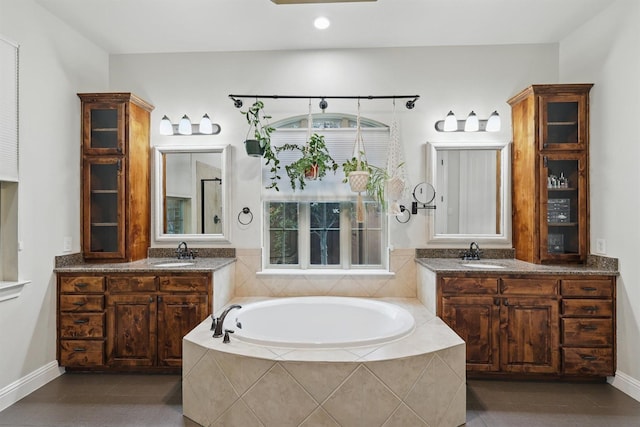 2428 Lilyfield Dr, Trophy Club, TX 76262 - full bathroom featuring a garden tub, two vanities, tile patterned flooring, and recessed lighting