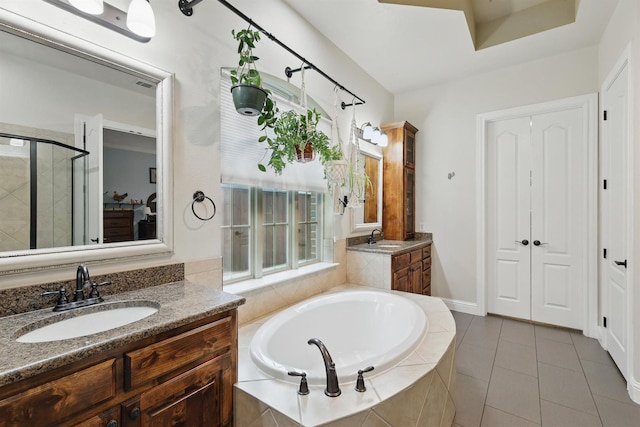 2428 Lilyfield Dr, Trophy Club, TX 76262 - full bath with a bath, a stall shower, two vanities, and tile patterned floors