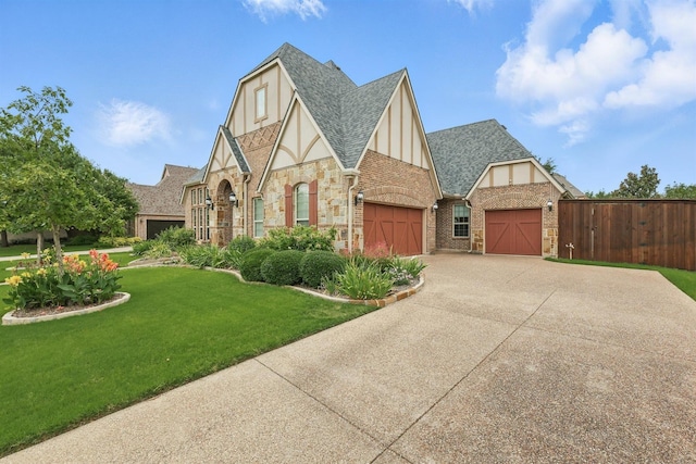 2428 Lilyfield Dr, Trophy Club, TX 76262 - tudor-style house with a garage, a shingled roof, driveway, board and batten siding, and stone siding
