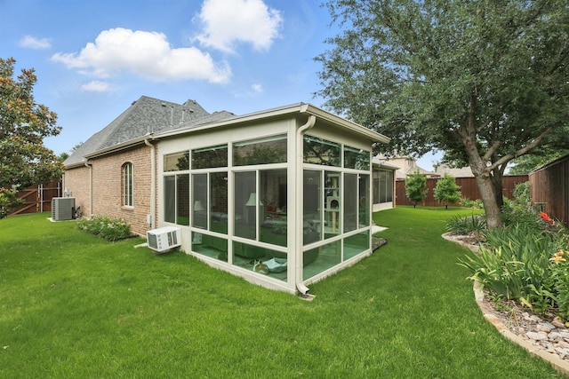 2428 Lilyfield Dr, Trophy Club, TX 76262 - back of property with a sunroom, a fenced backyard, and brick siding
