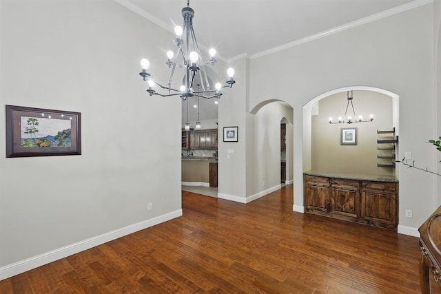 2428 Lilyfield Dr, Trophy Club, TX 76262 - unfurnished dining area with a chandelier, arched walkways, wood finished floors, and ornamental molding