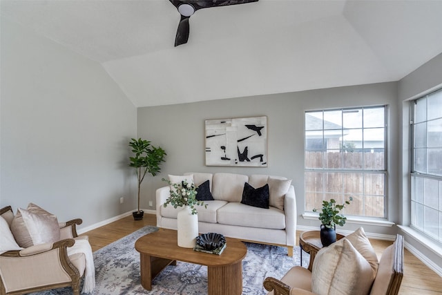 10715 Robincreek Ln, Frisco, TX 75035 - living room with lofted ceiling and wood finished floors