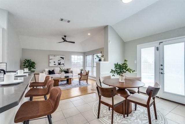 10715 Robincreek Ln, Frisco, TX 75035 - dining room with lofted ceiling, light tile patterned flooring, ceiling fan, and recessed lighting