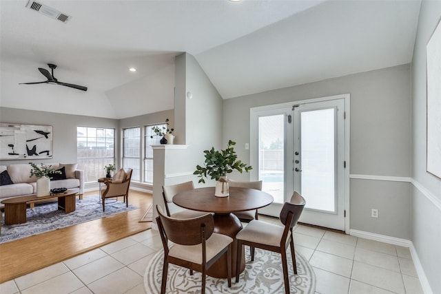 10715 Robincreek Ln, Frisco, TX 75035 - dining area with vaulted ceiling, light tile patterned floors, ceiling fan, and french doors