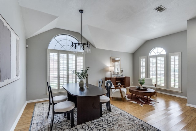 10715 Robincreek Ln, Frisco, TX 75035 - dining area with lofted ceiling, healthy amount of natural light, and light wood-style flooring