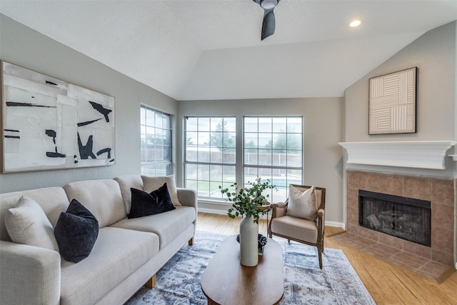 10715 Robincreek Ln, Frisco, TX 75035 - living area featuring lofted ceiling, light wood-type flooring, a fireplace, and recessed lighting