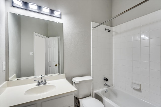 10715 Robincreek Ln, Frisco, TX 75035 - bathroom featuring  shower combination, vanity, and a textured wall