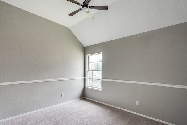 10715 Robincreek Ln, Frisco, TX 75035 - empty room featuring a ceiling fan, carpet flooring, and vaulted ceiling