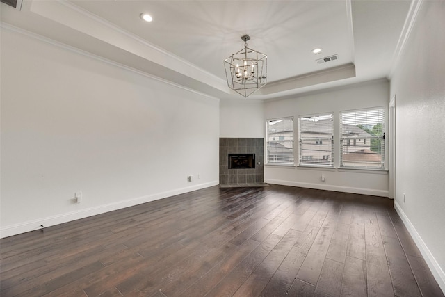 5513 Martel Ave, Dallas, TX 75206 - unfurnished living room featuring a raised ceiling, dark wood finished floors, a chandelier, ornamental molding, and recessed lighting