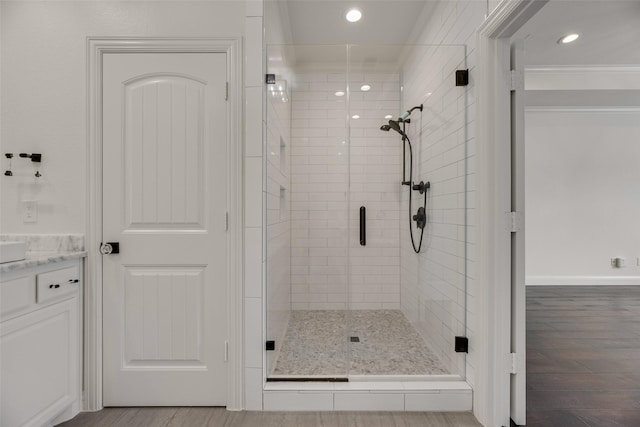 5513 Martel Ave, Dallas, TX 75206 - full bath featuring a stall shower, recessed lighting, wood finished floors, and vanity