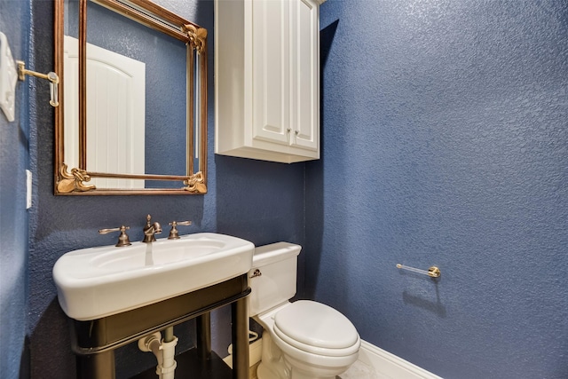 5513 Martel Ave, Dallas, TX 75206 - half bathroom with toilet and a textured wall