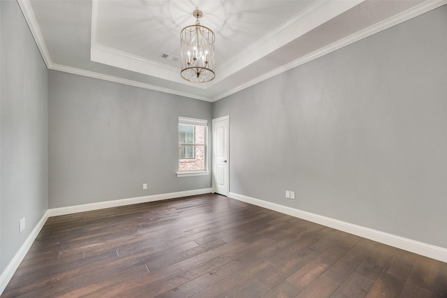 5513 Martel Ave, Dallas, TX 75206 - spare room with a chandelier, dark wood-type flooring, a raised ceiling, and crown molding