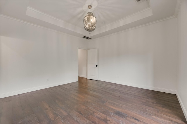 5513 Martel Ave, Dallas, TX 75206 - empty room featuring a tray ceiling, a chandelier, dark wood-style flooring, and crown molding