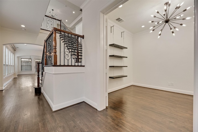 5513 Martel Ave, Dallas, TX 75206 - stairs featuring a chandelier, crown molding, arched walkways, wood finished floors, and recessed lighting