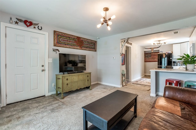 1103 1st Ave, Mckinney, TX 75069 - living room with a chandelier and light carpet