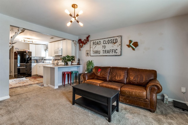1103 1st Ave, Mckinney, TX 75069 - living room featuring a chandelier and light carpet