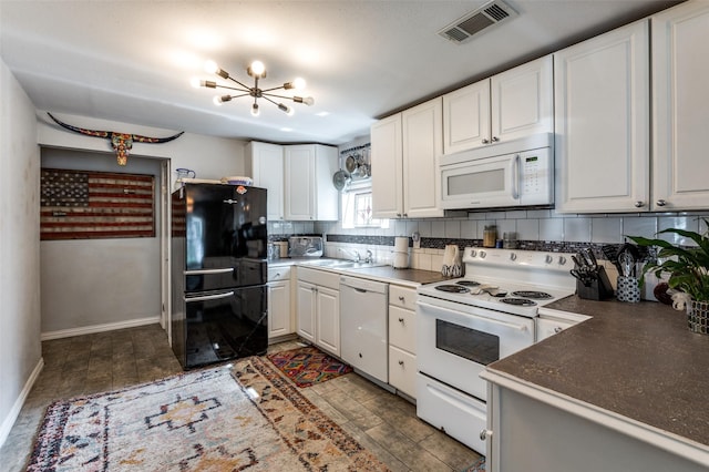 1103 1st Ave, Mckinney, TX 75069 - kitchen with white appliances, a chandelier, tasteful backsplash, white cabinetry, and dark countertops